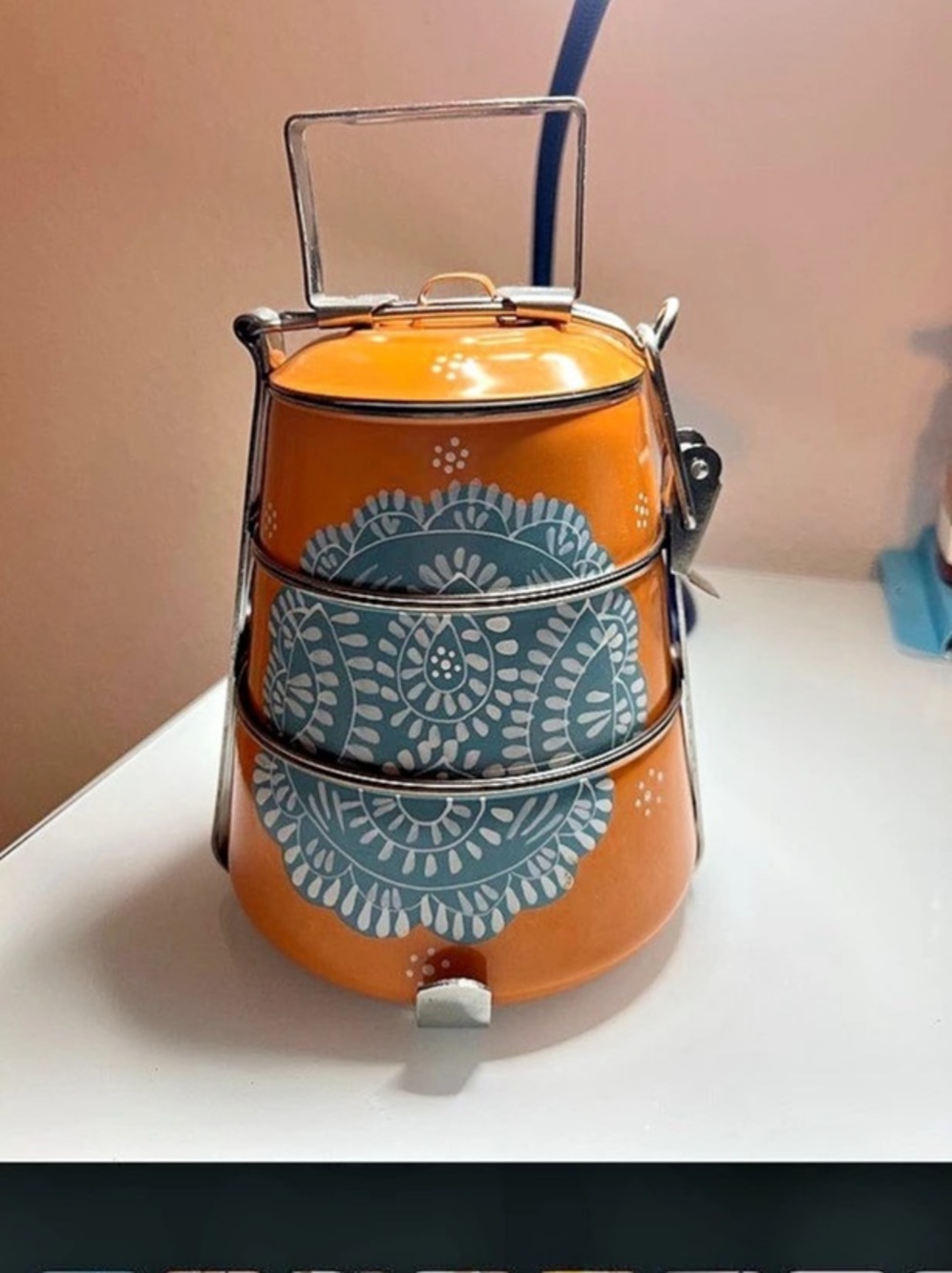 Ten Thousand Villages 3 Tier Steel Tiffin To Go Container in orange.